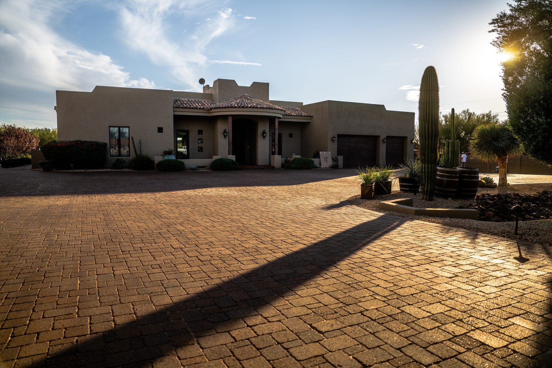 Sealed paver driveway with saguaro shadow